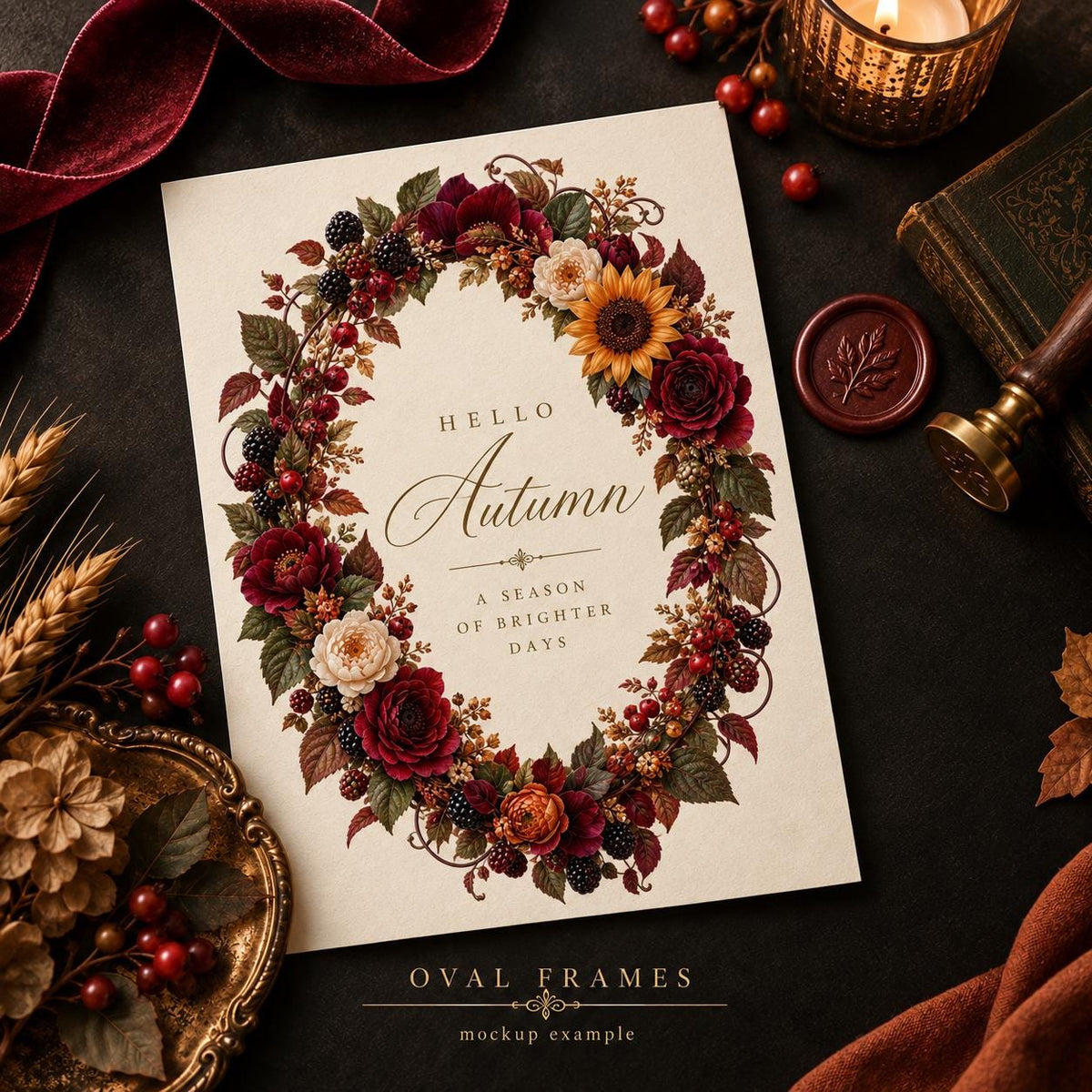 A rectangular card featuring an oval floral wreath made of sunflowers, red roses, and blackberries. The text reads Hello Autumn, A season of brighter days. The card is surrounded by a velvet ribbon, a candle, a wax seal, and wheat stalks.